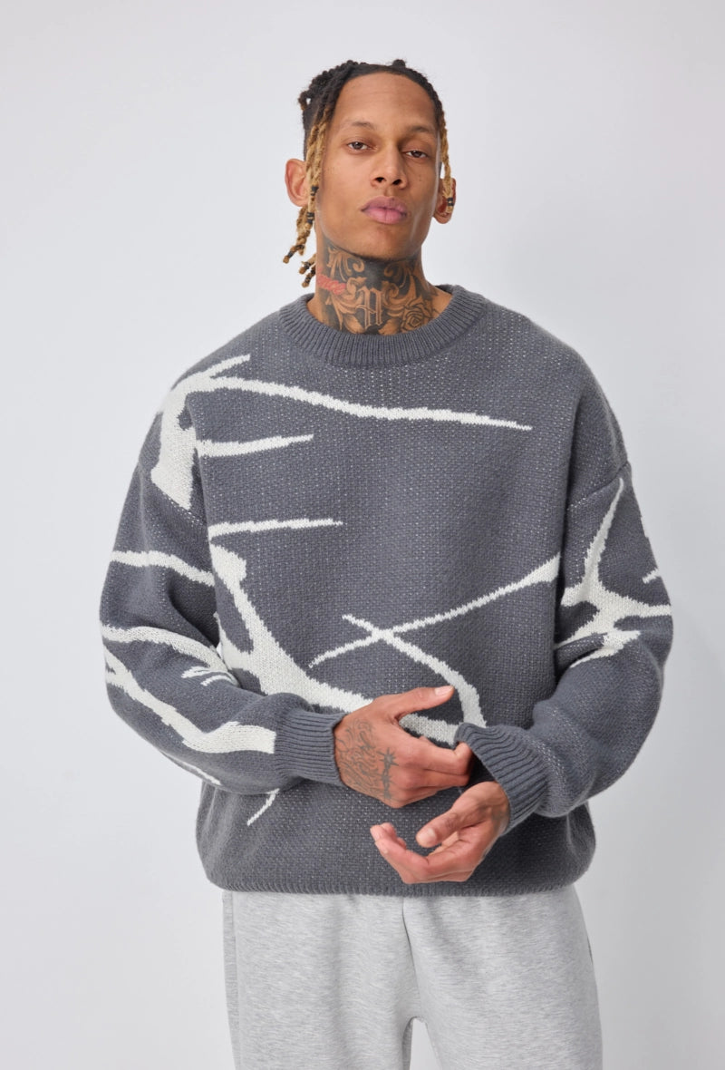 Pull col rond à motif branche d'arbre sur l'ensemble du pull