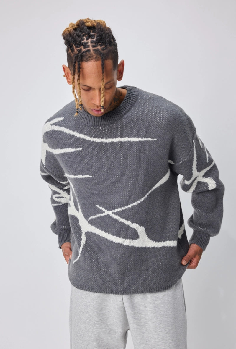 Pull col rond à motif branche d'arbre sur l'ensemble du pull