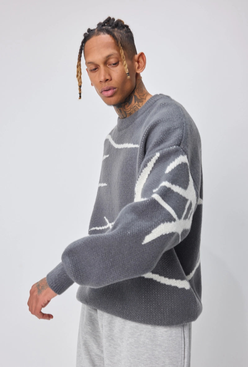 Pull col rond à motif branche d'arbre sur l'ensemble du pull