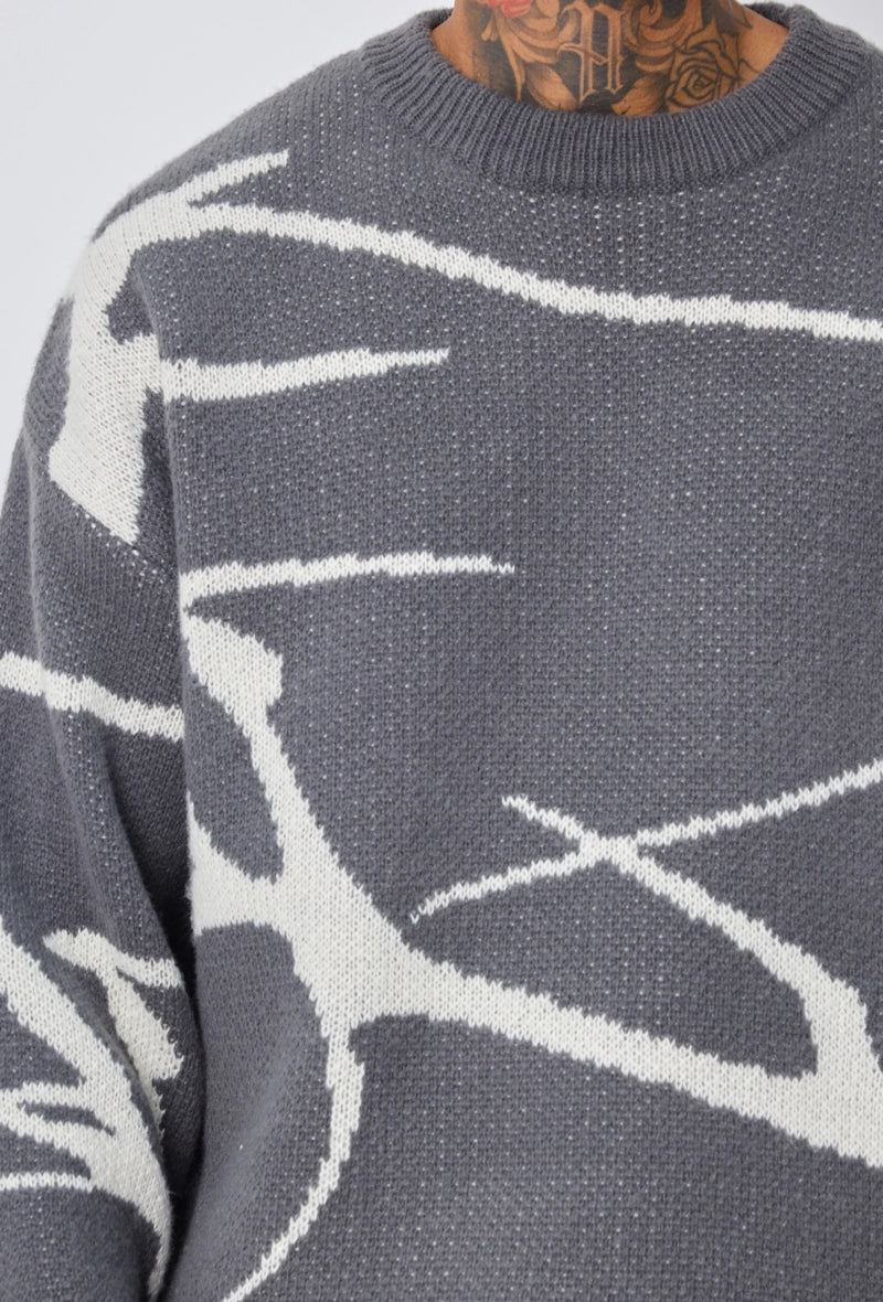 Pull col rond à motif branche d'arbre sur l'ensemble du pull