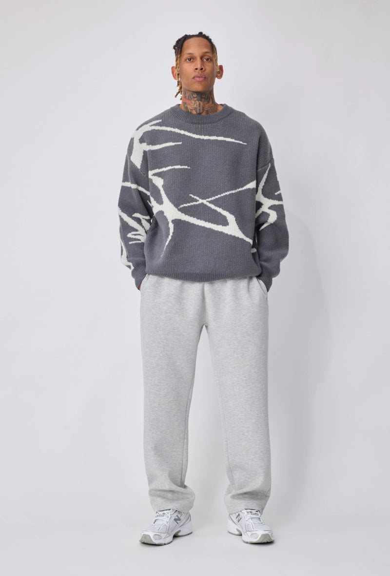 Pull col rond à motif branche d'arbre sur l'ensemble du pull