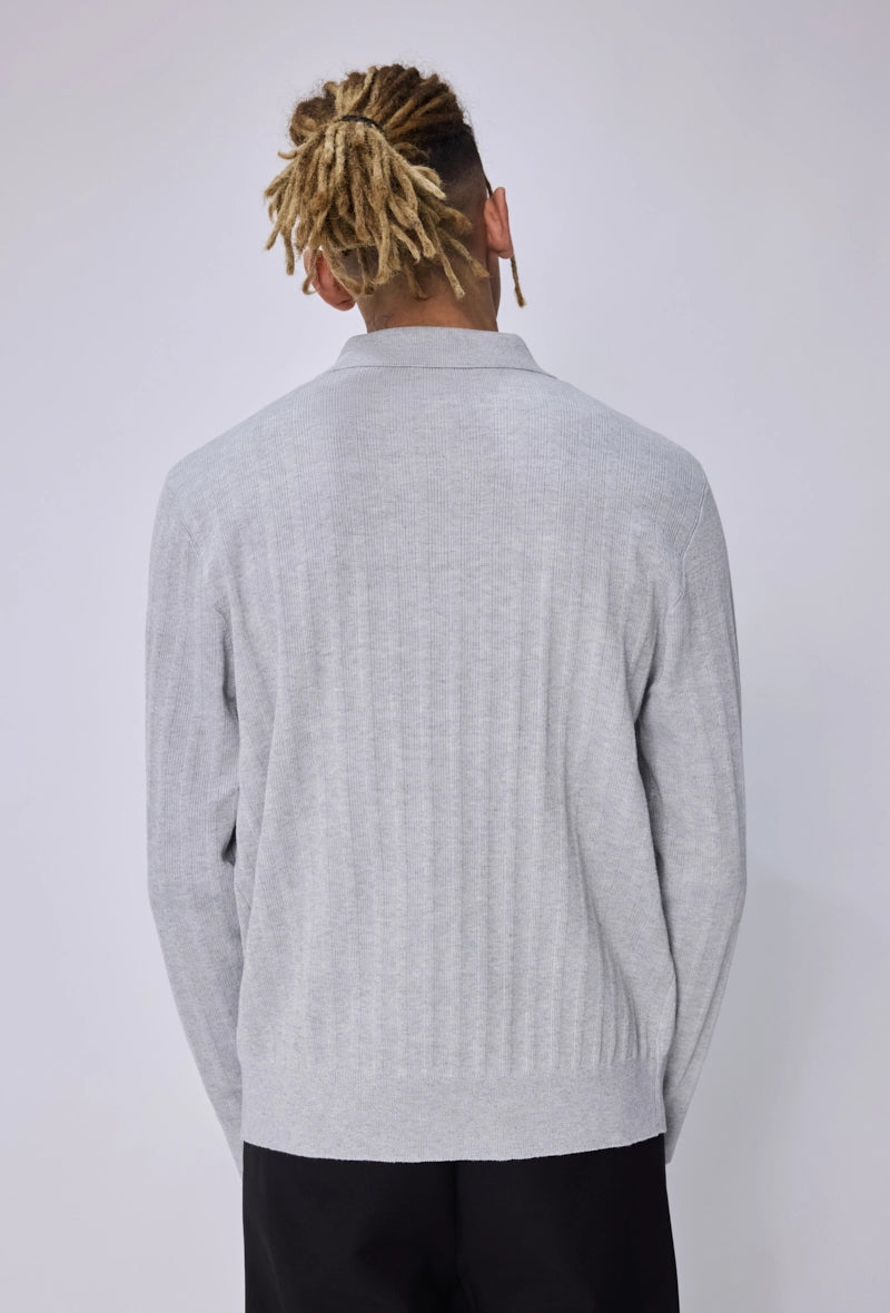 Pull col polo zippé côtelé