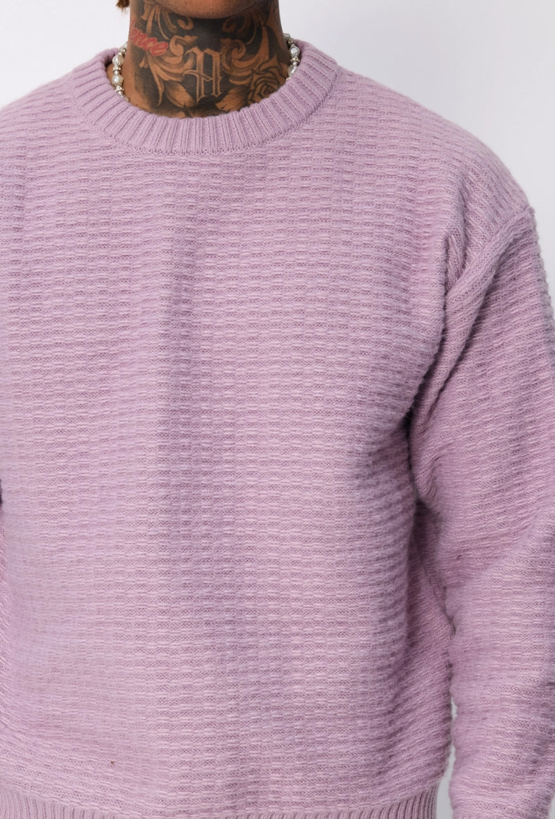 Pull uni à motif tressé