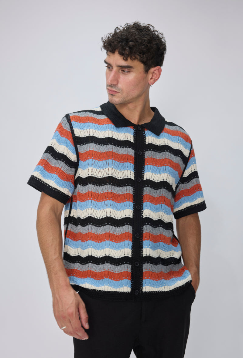Polo tricoté rayures vagues
