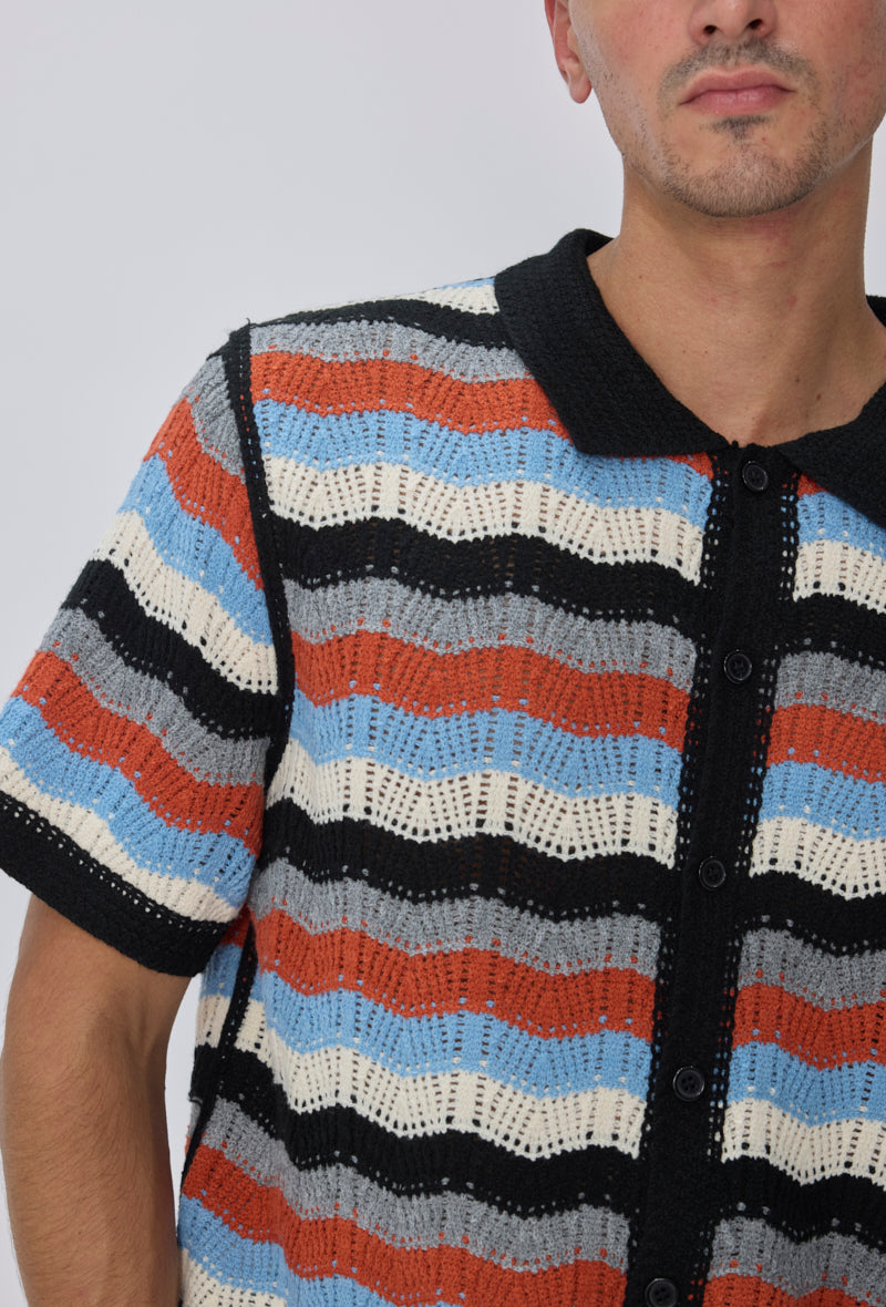 Polo tricoté rayures vagues