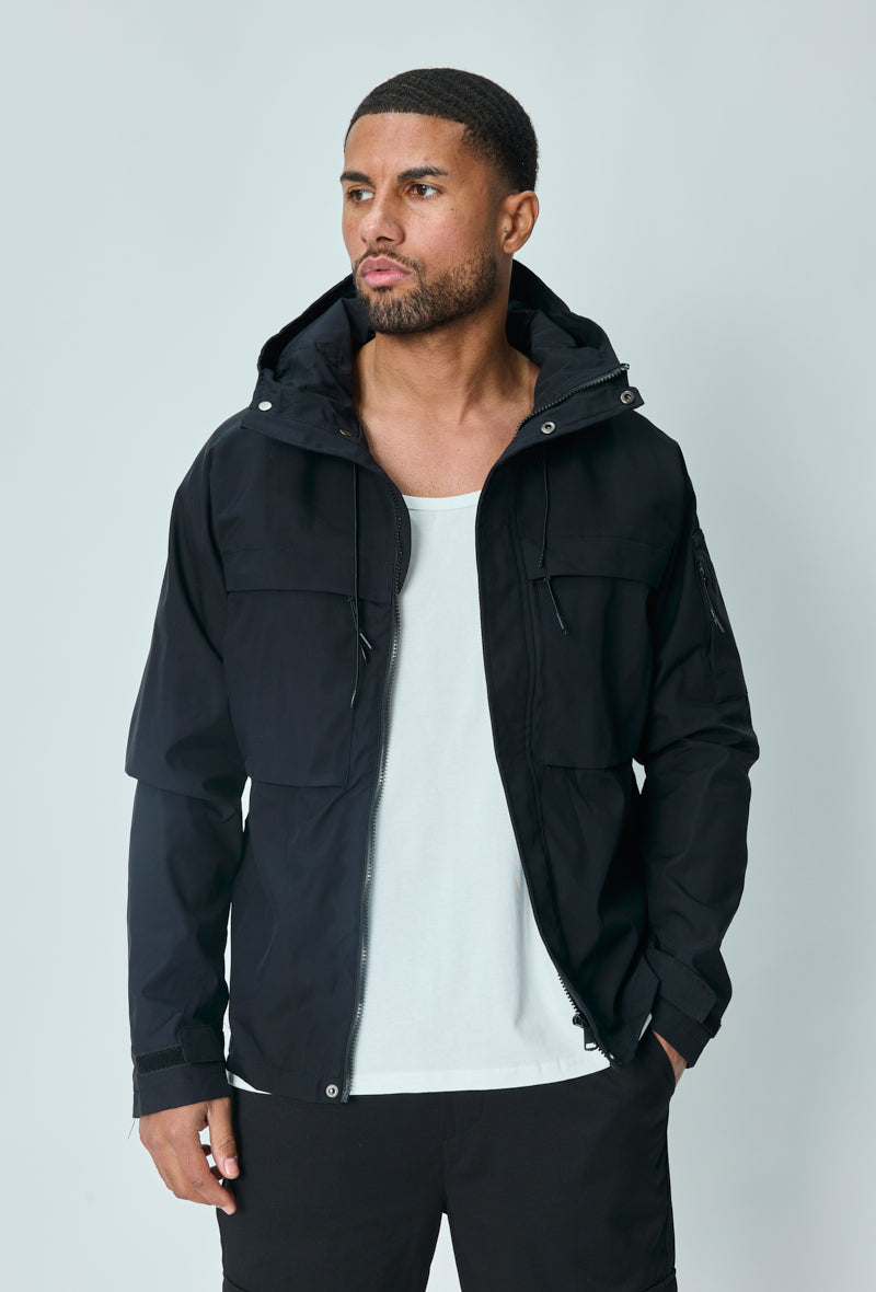Short jacket with adjustable hood with drawstring