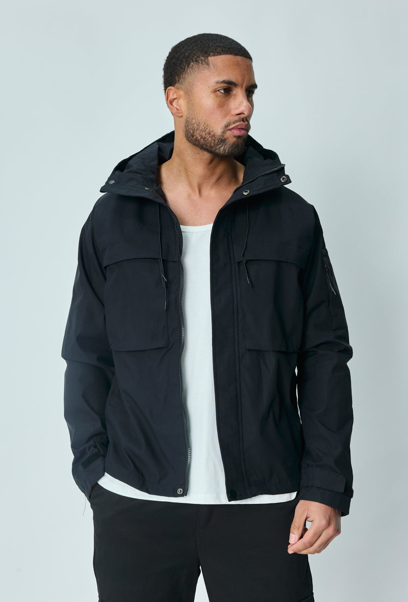 Short jacket with adjustable hood with drawstring