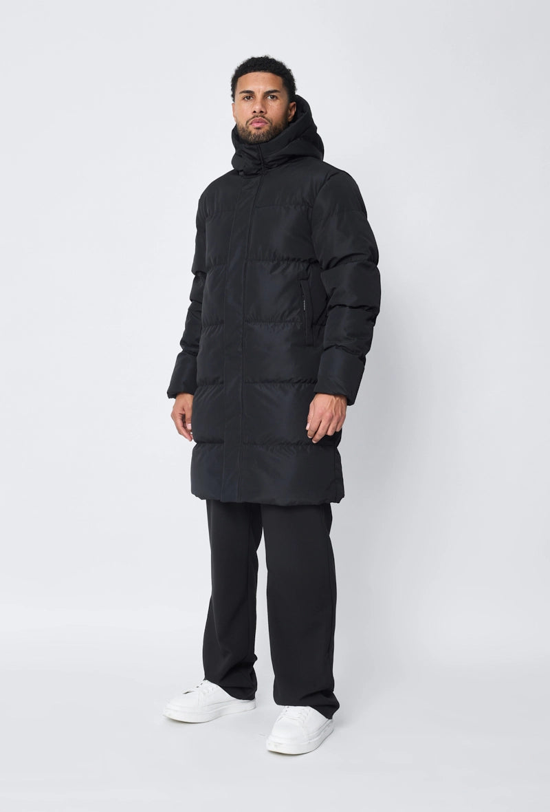 Blouson matelassé long à capuche