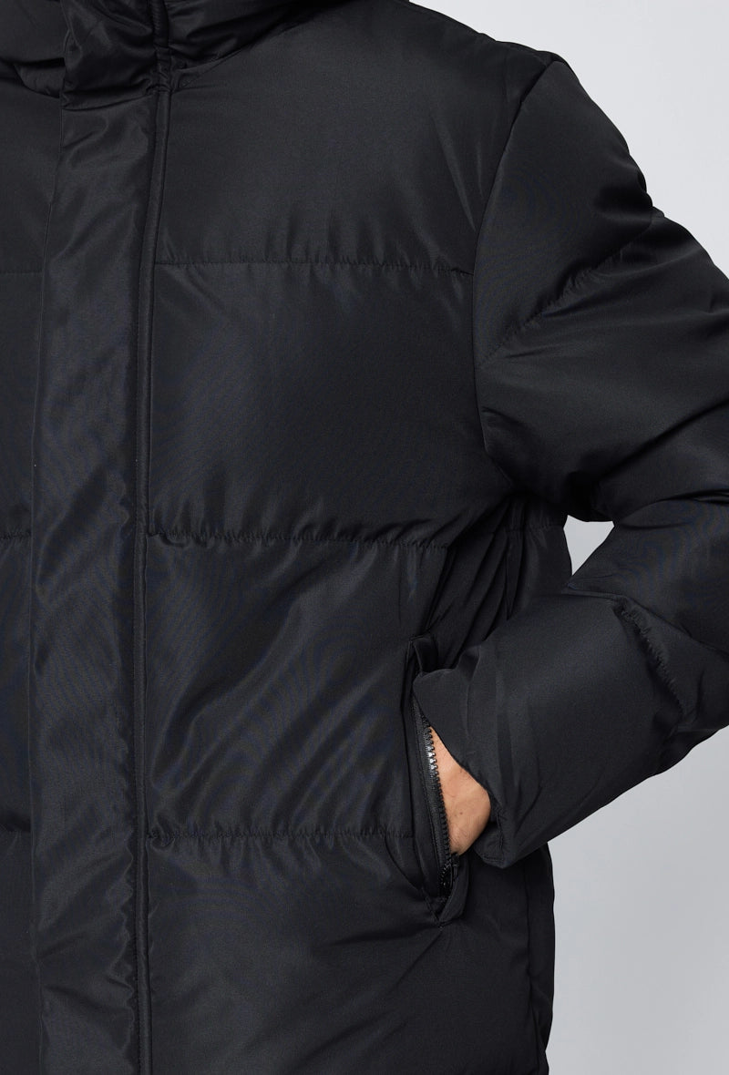 Blouson matelassé long à capuche