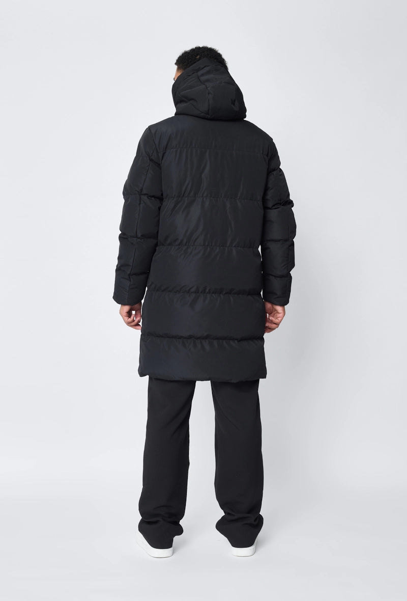 Blouson matelassé long à capuche