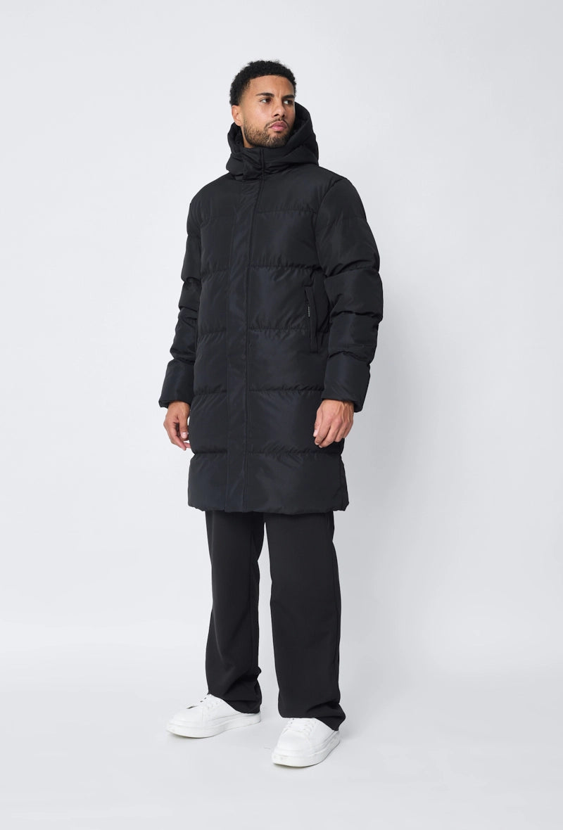 Blouson matelassé long à capuche