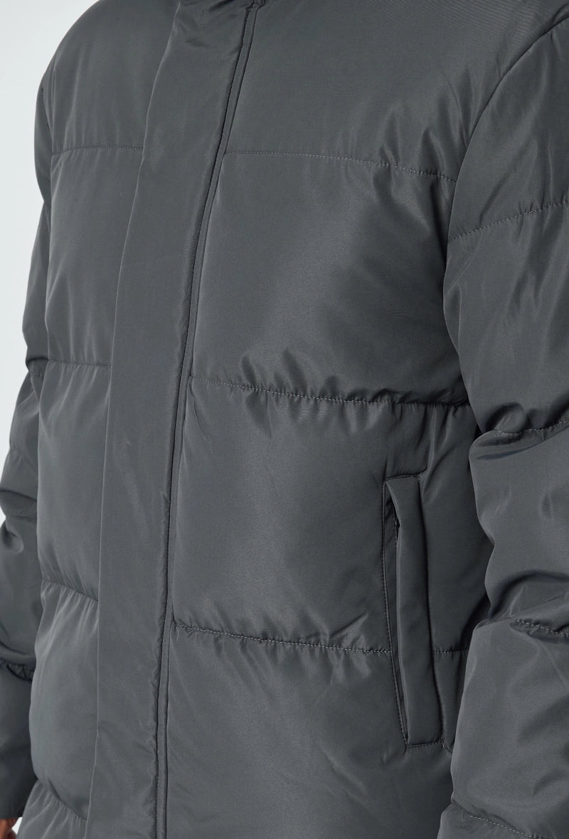 Blouson matelassé long à capuche
