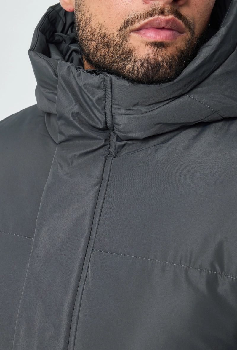 Blouson matelassé long à capuche