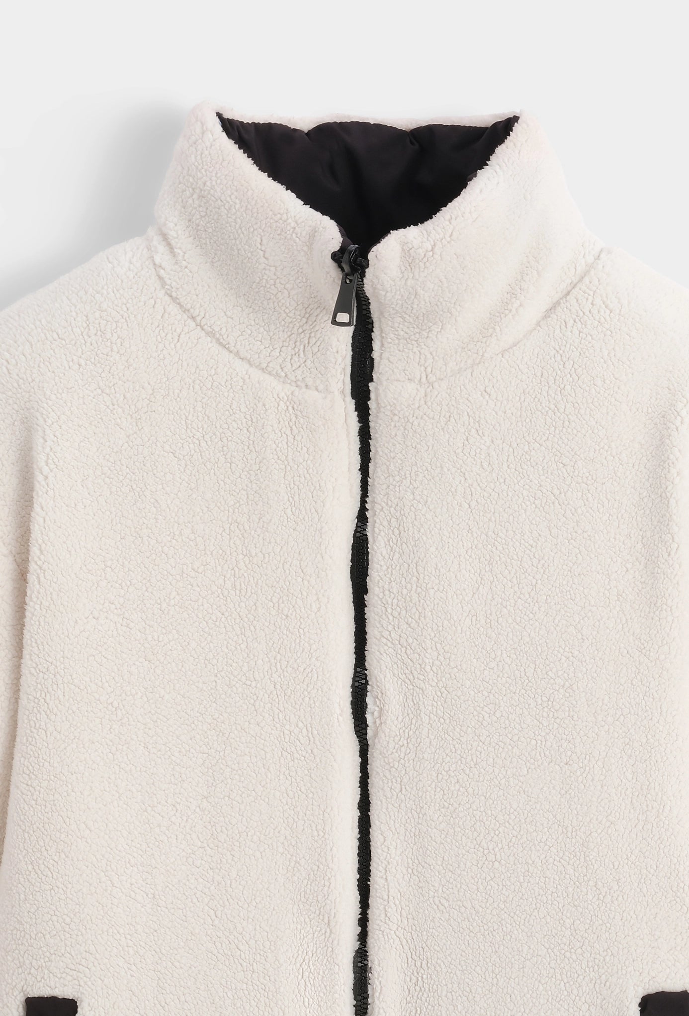 Manteau réversible bimatière