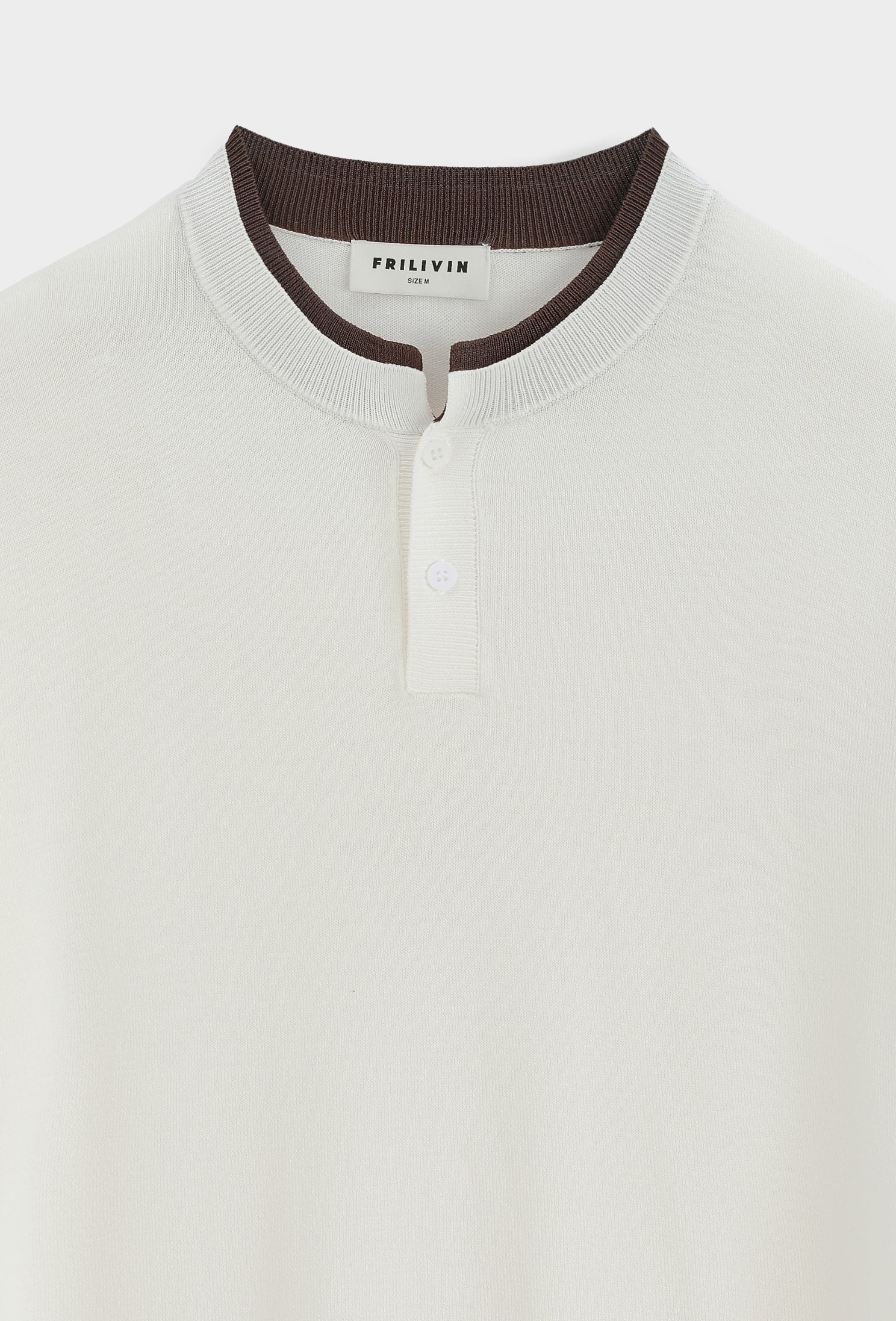 Polo tricoté col montant