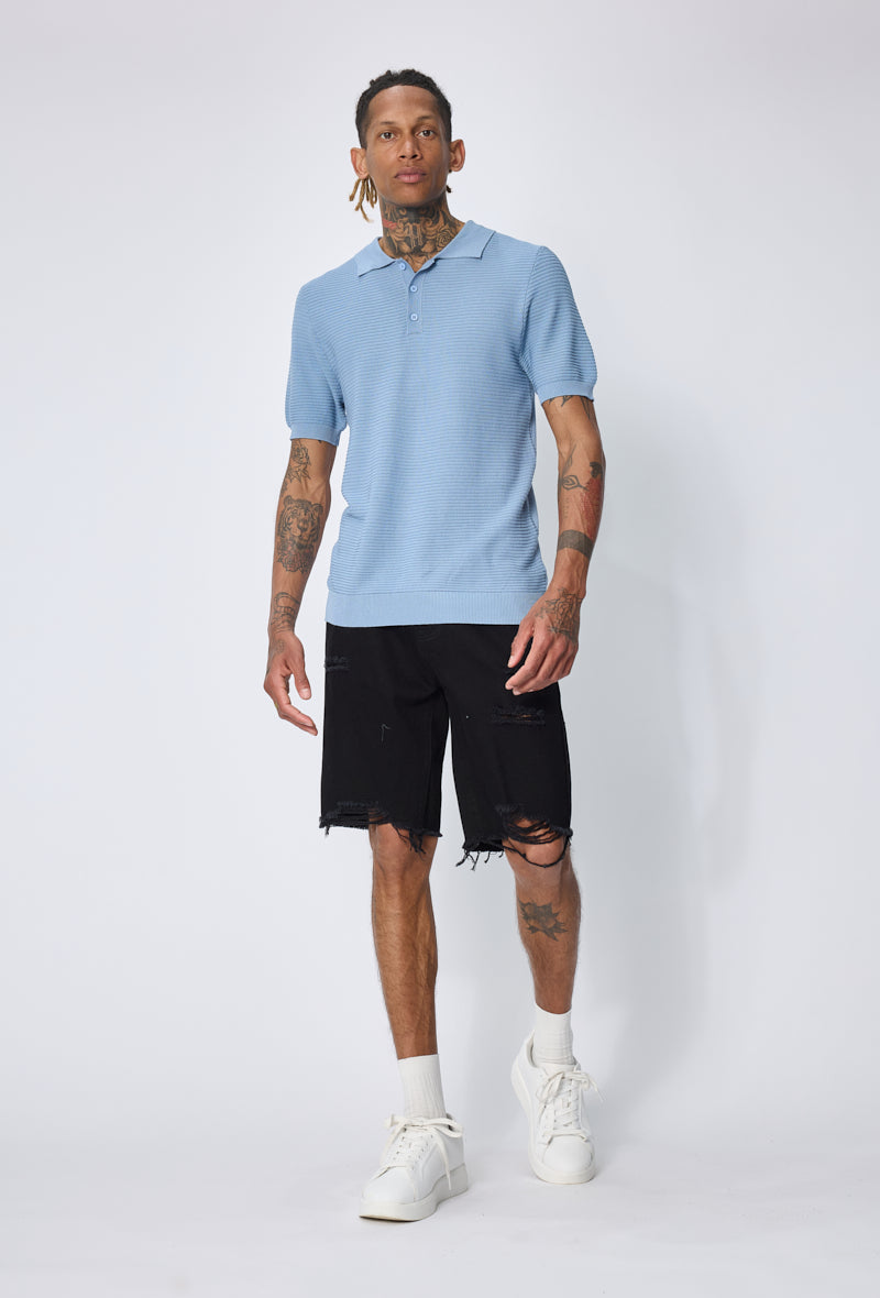 Polo tricoté col ouvert