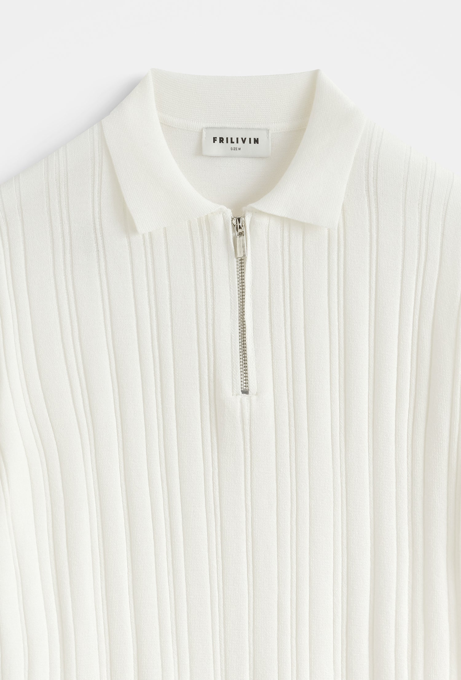 Polo zippé côtelé structuré