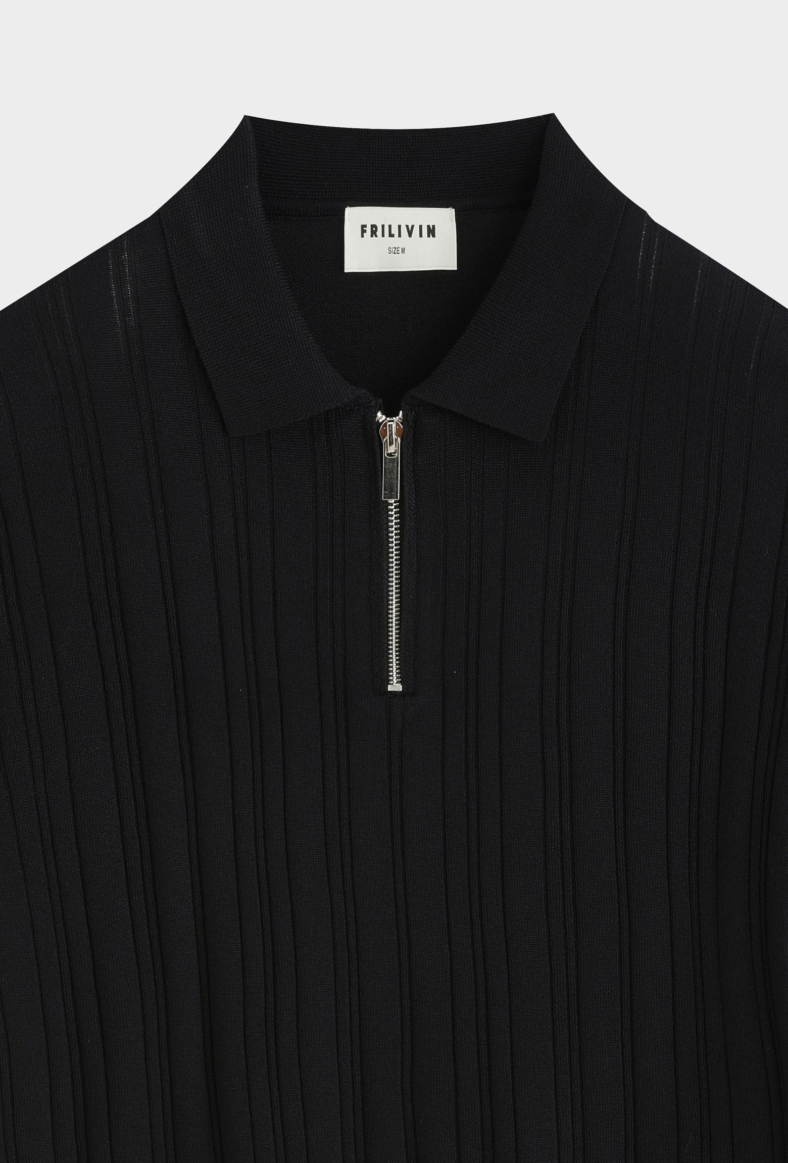 Polo zippé texturé