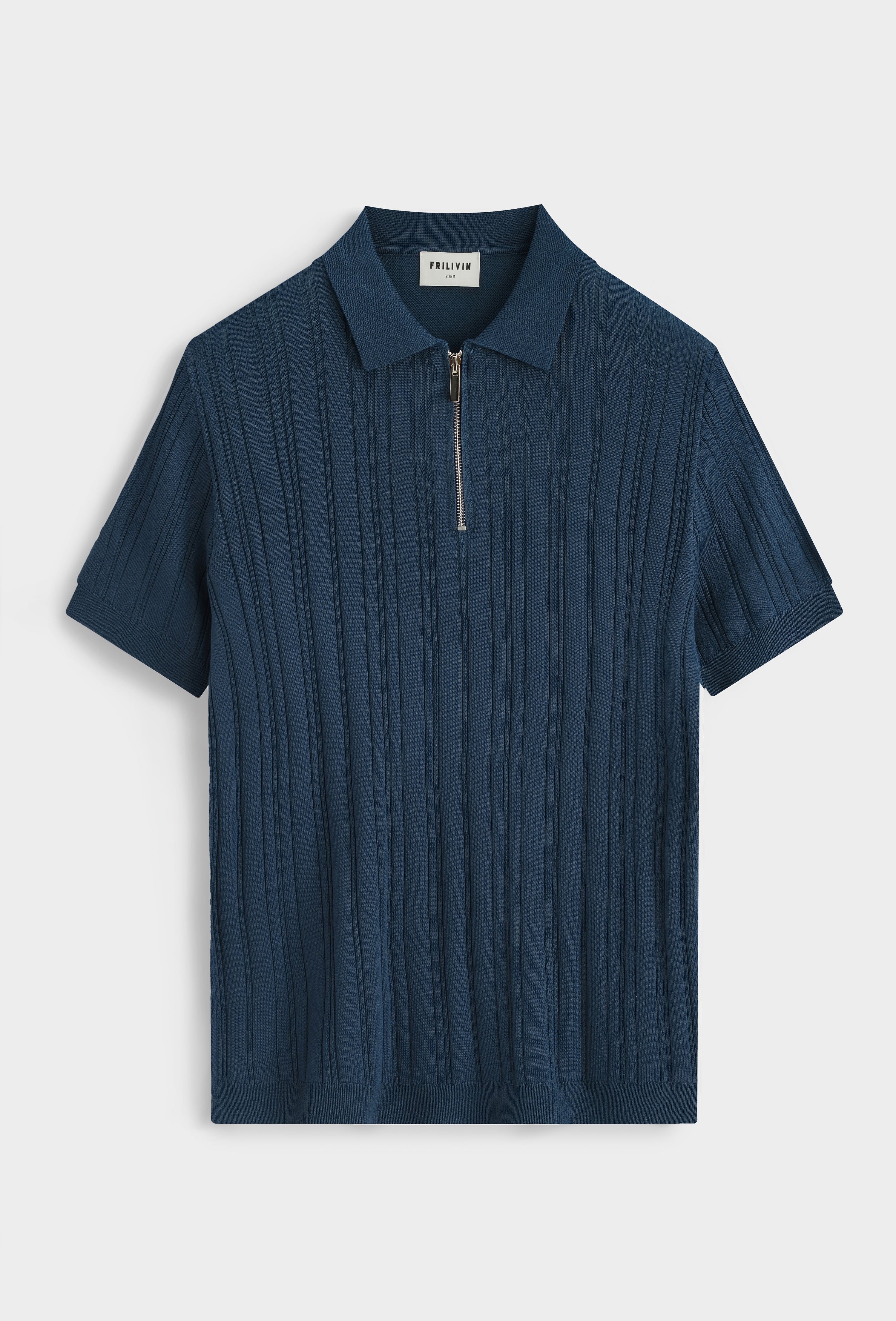 Polo zippé texturé