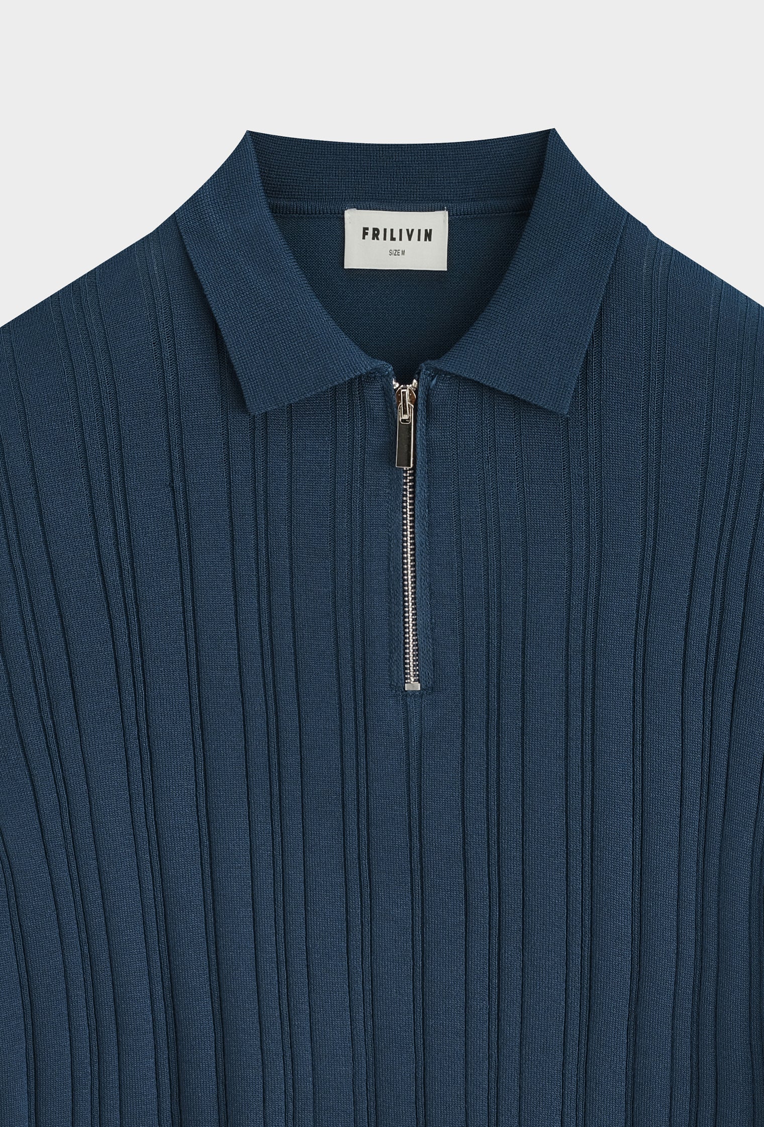 Polo zippé texturé