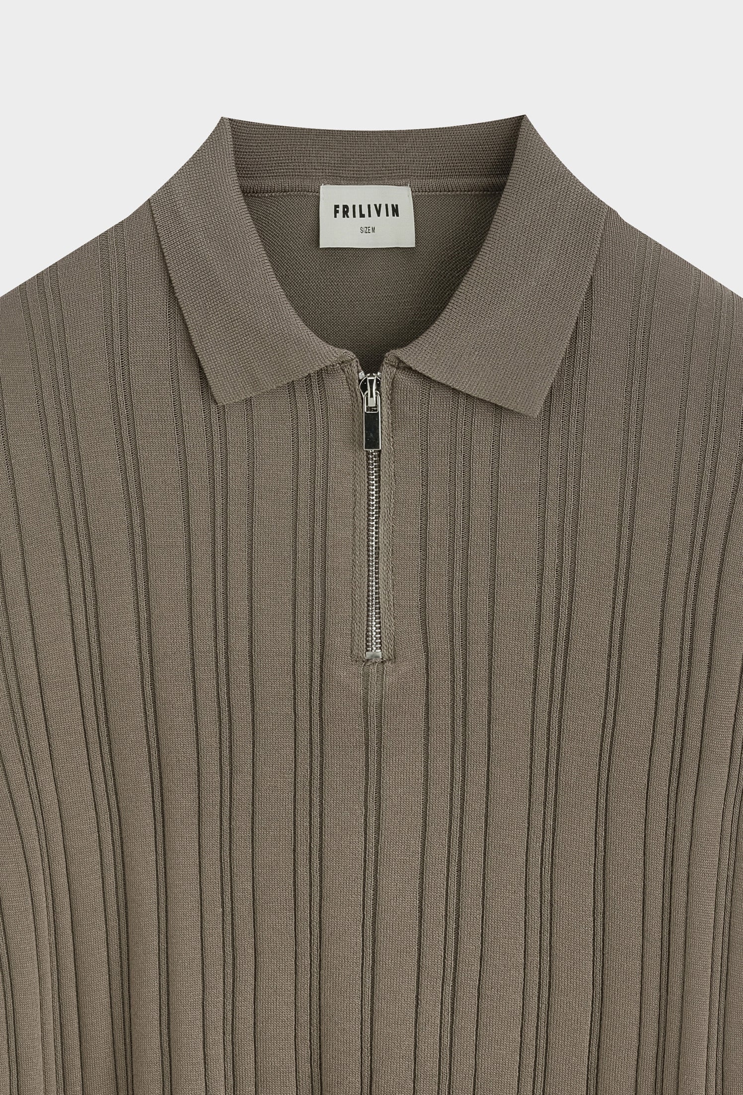 Polo zippé texturé