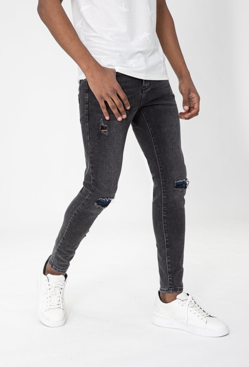 Jean effet déchiré avec empiècement - Frilivin